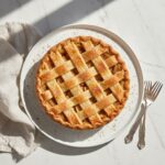 Delicious Apple Pie by Grandma Ople, whole and golden-brown.