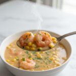 Scoop of Creamy Cajun Shrimp and Corn Soup, close-up