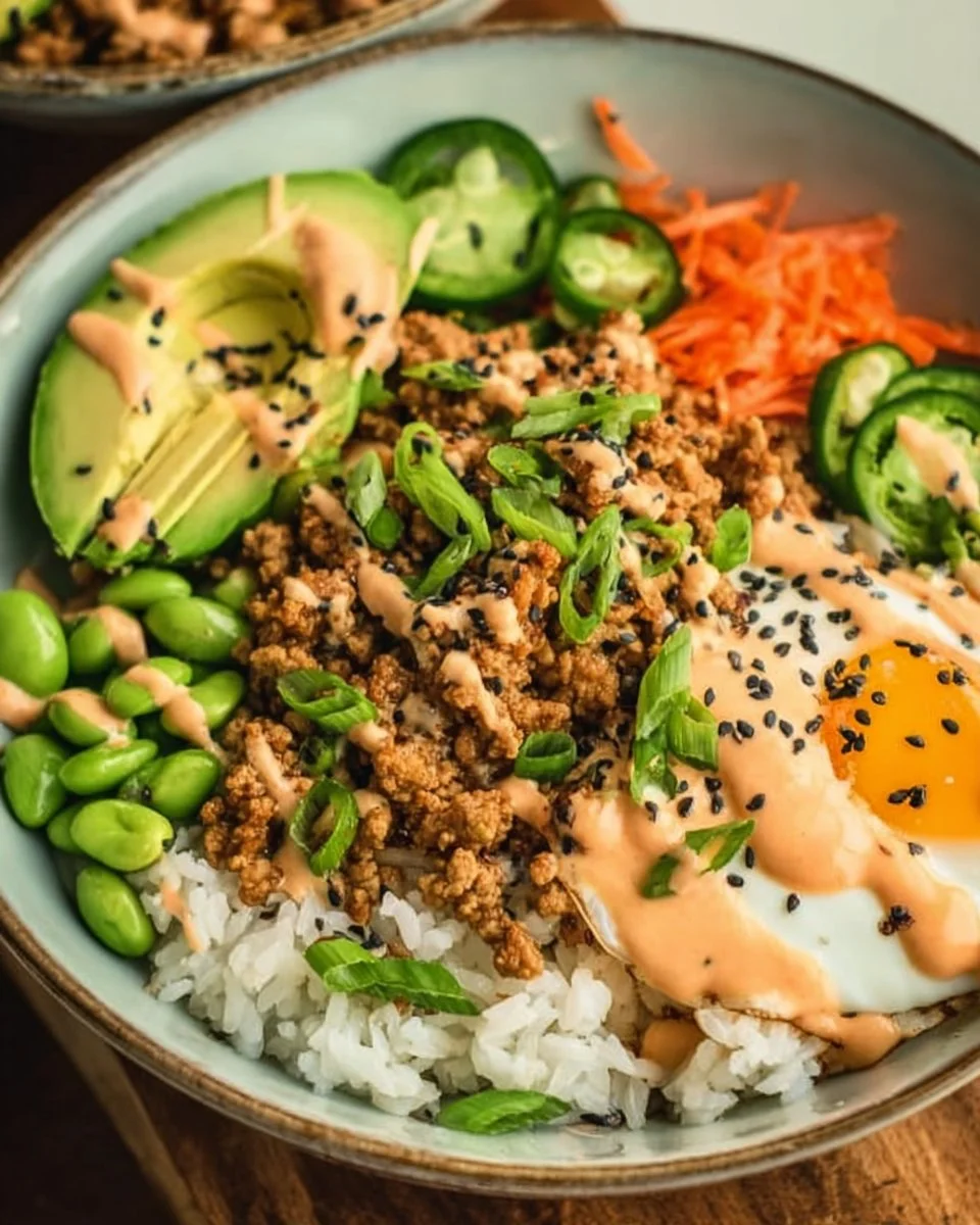 Ground turkey rice bowls drizzled with Bang Bang sauce for a flavorful dish.