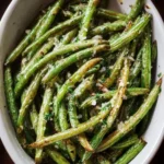 Oven-roasted green beans on a plate, perfect side dish for quick meals.